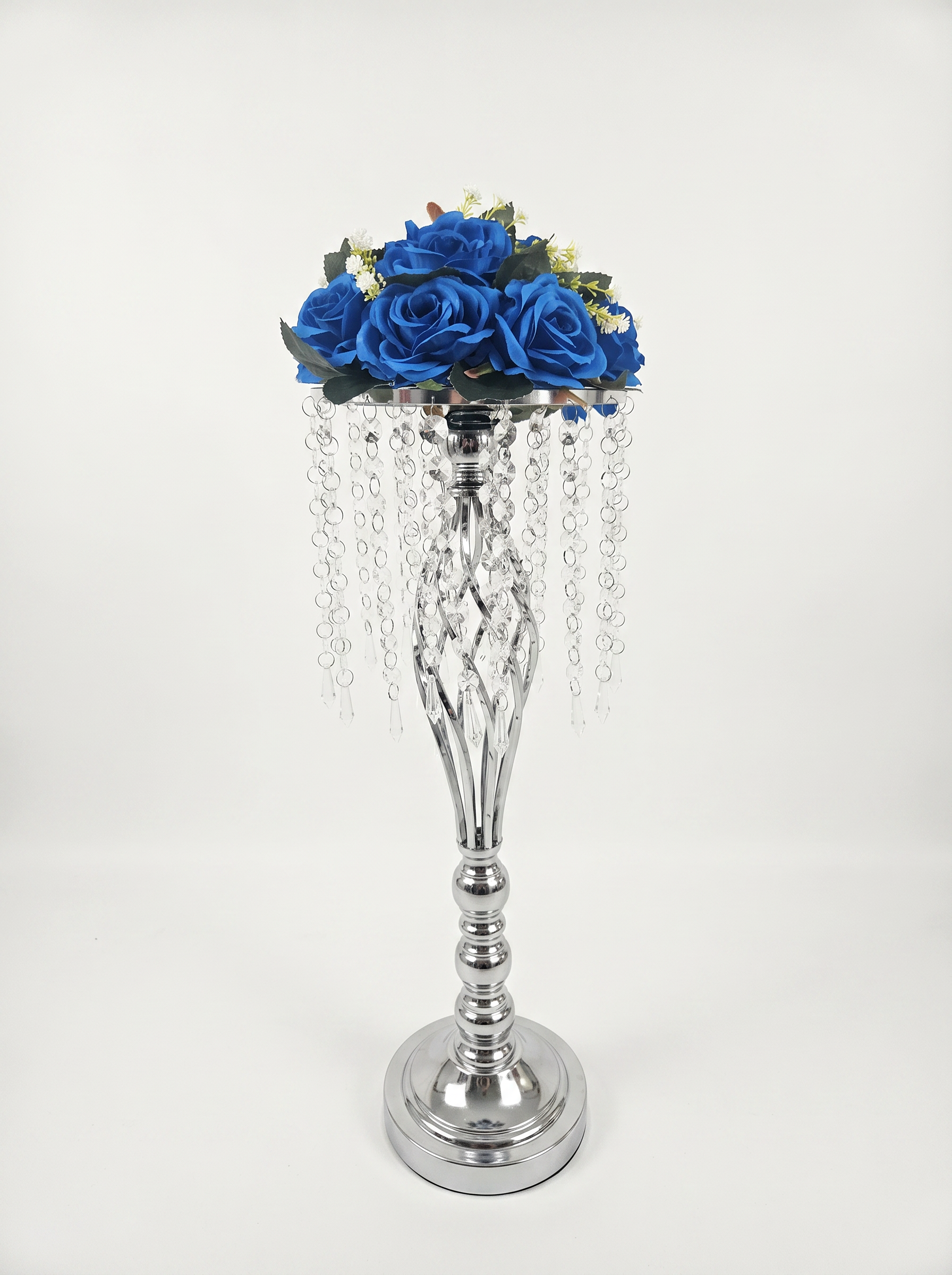Center piece with blue roses and crystal droplets